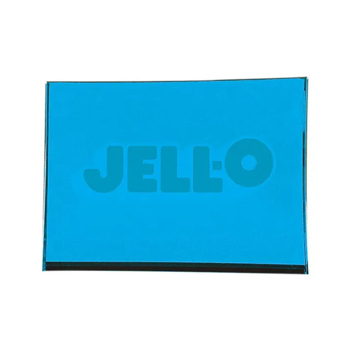 Hand squeezing a purple rectangular Jell-O Squishi toy, bending the soft sides around the embossed Jell-O logo.