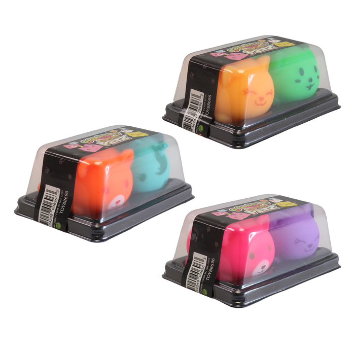Three sets of colorful dice in clear plastic packaging on a white background