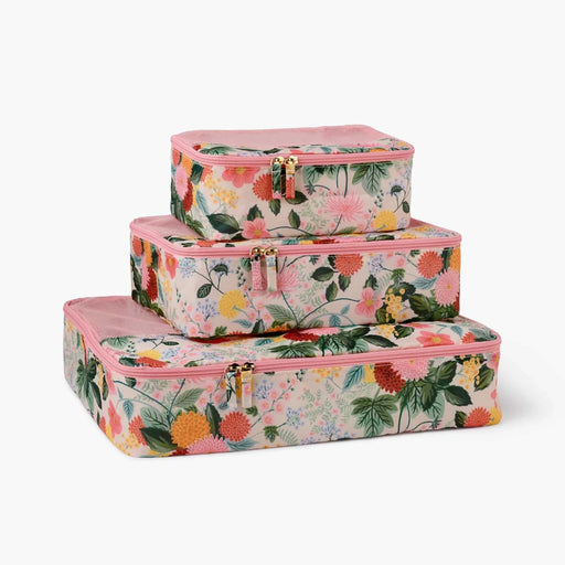 A set of packing cubes designed to keep clothing and travel essentials neatly organized for stress-free packing.