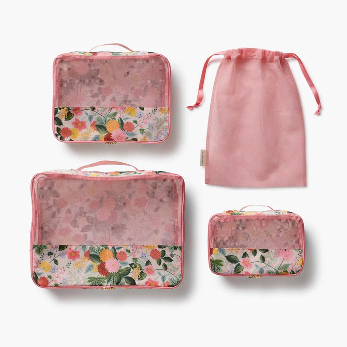 A set of packing cubes designed to keep clothing and travel essentials neatly organized for stress-free packing.