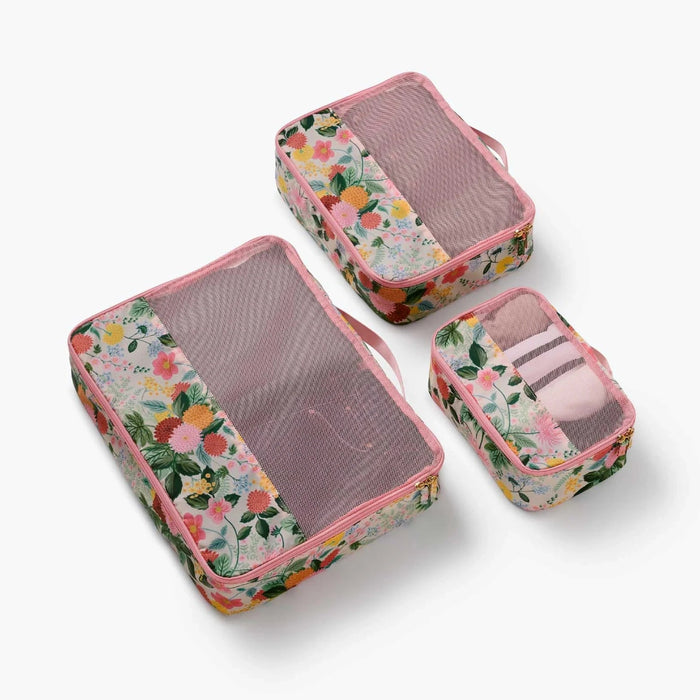 A set of packing cubes designed to keep clothing and travel essentials neatly organized for stress-free packing.