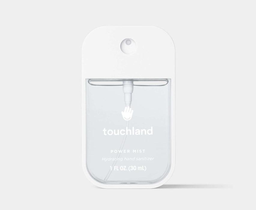 Clear Touchland power mist packaging on a light gray background