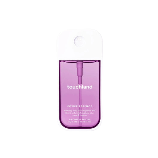 Purple bottle of touchland Cashmere Woods Body Mist Power Essence on a white background
