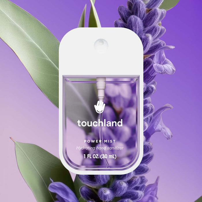 Touchland Pure Lavender hand sanitizer with lavender and green leaves on a purple background