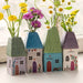 A vibrant vase of flowers positioned on a window sill, adding charm to the bright interior space.