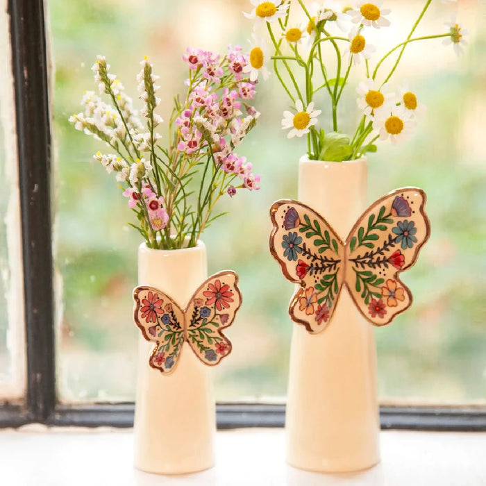 A vase adorned with a butterfly motif, highlighting its artistic craftsmanship and elegance.