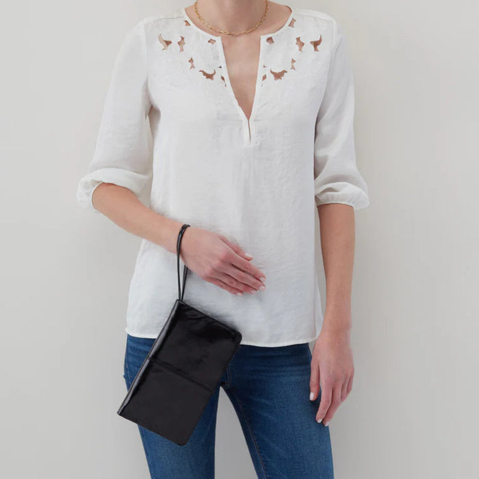 The Hobo Evolve Wristlet Black is a sleek and versatile accessory designed to keep your everyday essentials organized in style.