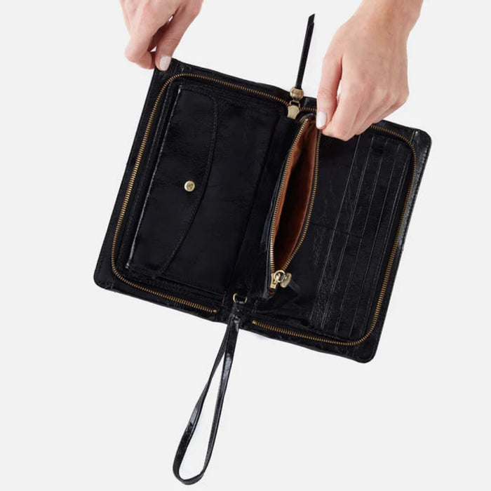 The Hobo Evolve Wristlet Black is a sleek and versatile accessory designed to keep your everyday essentials organized in style.