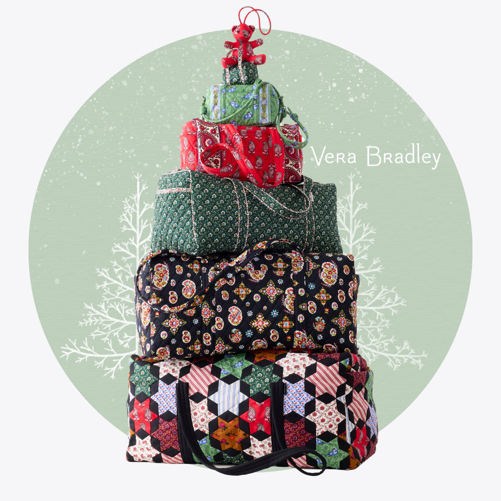 Stack of Vera Bradley bags with a Christmas tree on a light green background