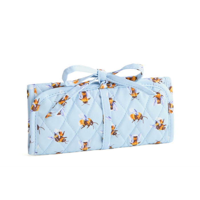 Folded Vera Bradley Jewelry Roll in Bee's Knees with bee pattern, and tied bow closure.