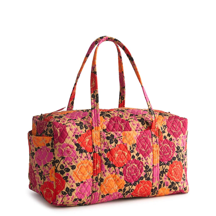 Front view of Vera Bradley Large Original Duffel Bag in Coming Up Roses featuring vibrant pink, orange, and red floral print on tan background.