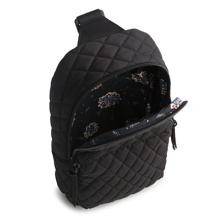 Interior view of Vera Bradley Lorman Sling Backpack in Moonless Night showing black floral lining and zip pocket.