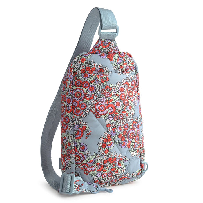 Side angle of Vera Bradley Lorman Sling Backpack in Paisley Bouquet highlighting adjustable strap and compact silhouette.