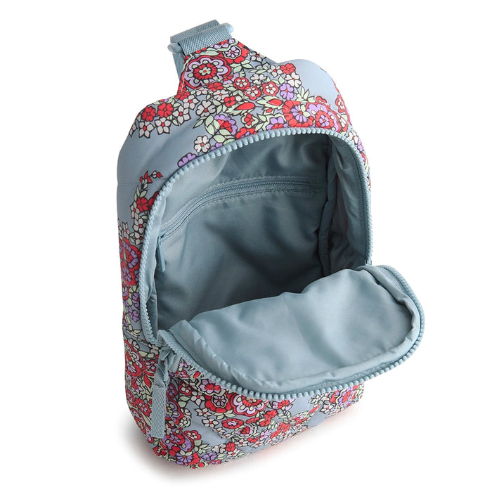 Open view of Vera Bradley Lorman Sling Backpack in Paisley Bouquet showing spacious interior with zip pocket.