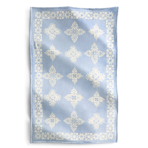 Vera Bradley Plush Throw Blanket in North Star Sky Snowflake laid flat showing blue background with white snowflake pattern.