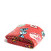 A folded Vera Bradley plush throw blanket showing the same red candy-themed pattern with wrapped candies, cupcakes, and sweet treats.