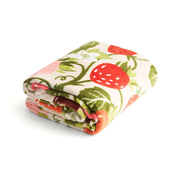Folded Vera Bradley Plush Throw Blanket in Strawberry Vines fleece pattern with colorful strawberries and green leaves on a cream background