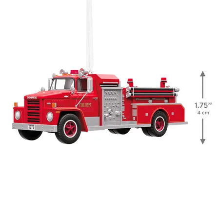 Red plastic fire truck ornament with size indicator and white hanging loop