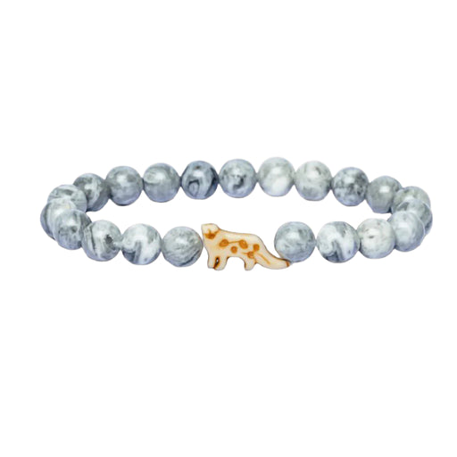 Grey marbled beaded bracelet with a  snow leopard charm on a white background