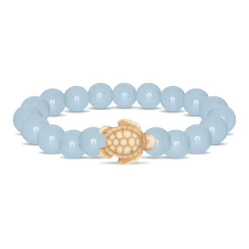 Fahlo Journey Aqua Glow Sea Turtle Bracelet featuring glow-in-the-dark aqua beads, engraved turtle charm, interactive real sea turtle tracking, and support for marine wildlife conservation.