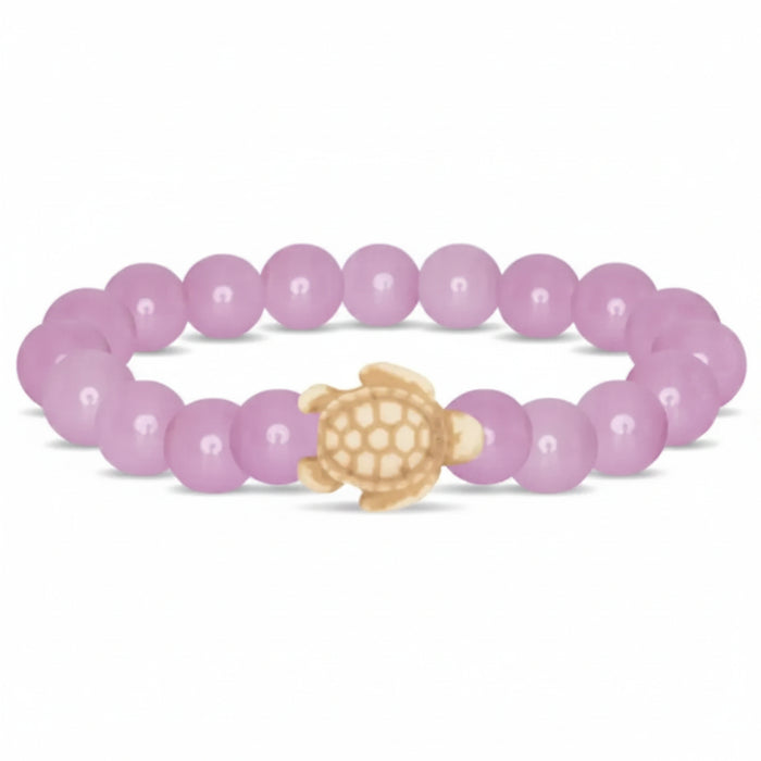 Fahlo Journey Lilac Glow Sea Turtle Bracelet with glow-in-the-dark lilac beads, sea turtle charm, real turtle tracking, and marine wildlife conservation support.