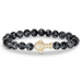 Fahlo Quest Black beaded bracelet with a white whale shark charm on a white background