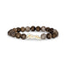 A bracelet featuring a combination of white and brown stones, elegantly arranged for a stylish look.