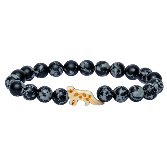 Black beaded bracelet with a small snow leopard charm on a white background