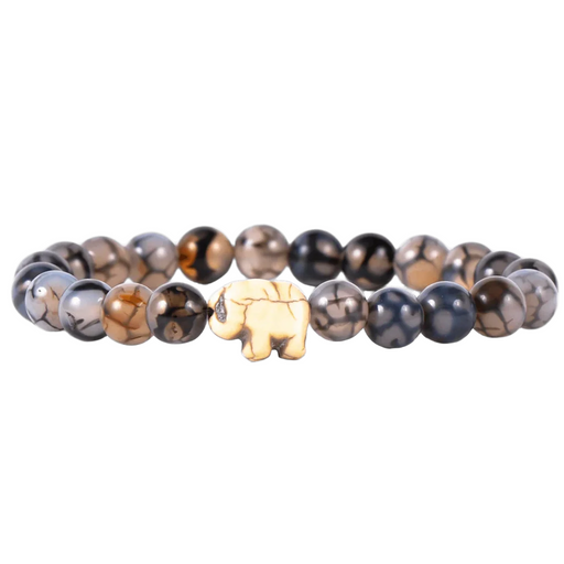 Bracelet with beaded design and a elephant charm on a white background