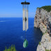 Elegant stone wind chime with green agate representing balance and nature