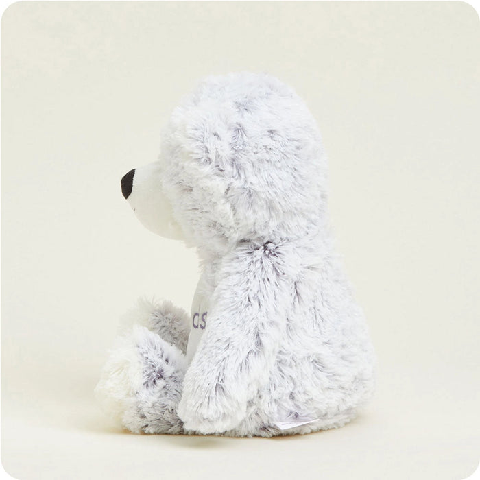 Side view of Warmies Friends Bear Plush highlighting plush texture, rounded shape, and soft stuffed arms and legs