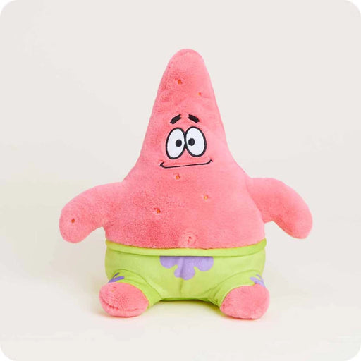 Warmies Patrick Star plush toy sitting upright wearing green shorts, soft pink fabric and friendly embroidered face