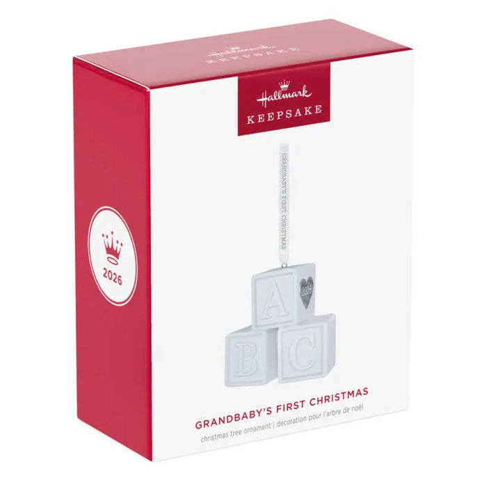 Hallmark Keepsake ornament packaging for 'Grandbaby's First Christmas' with red and white design.
