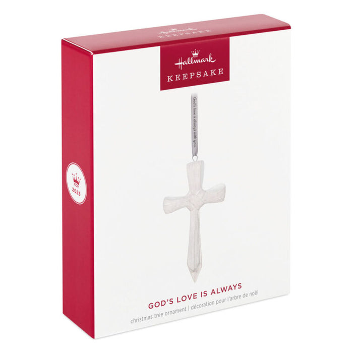 Hallmark Keepsake Christmas ornament packaging with a cross design on a white background