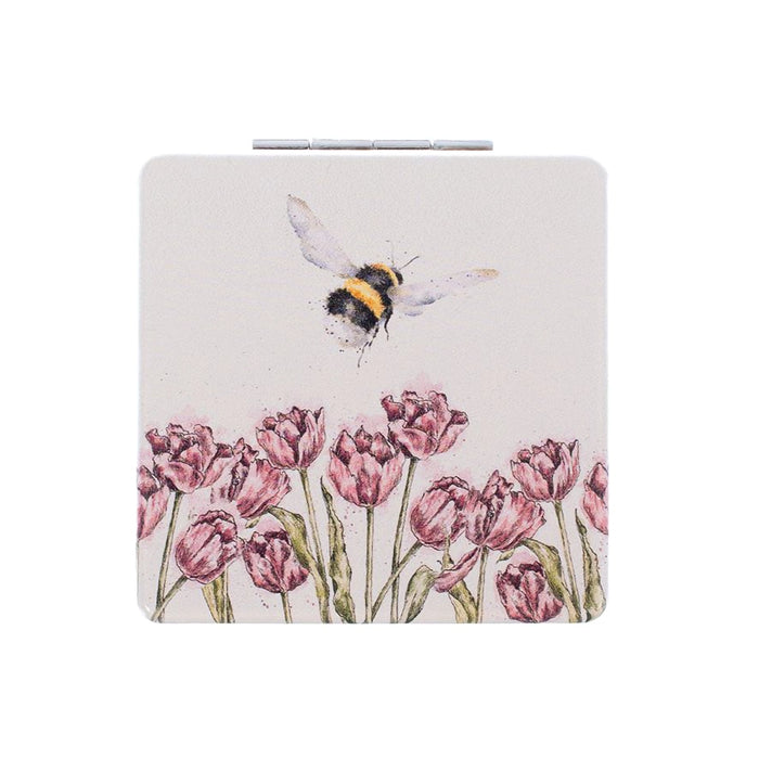 Wrendale Designs Flight of the Bumblebee compact mirror with bumblebee flying above pink tulips, illustrated by Hannah Dale.