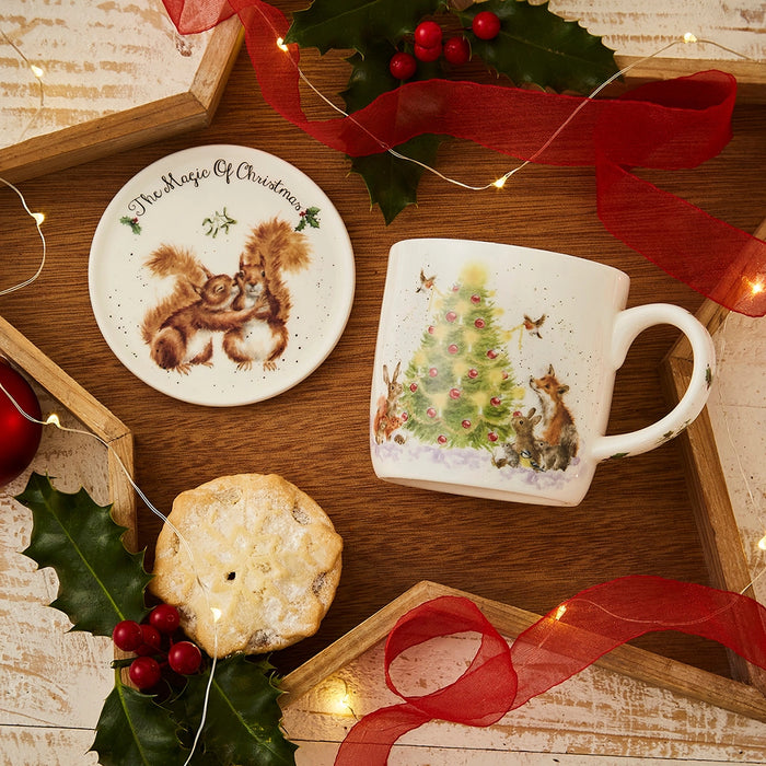 Wrendale Designs Oh Christmas Tree mug displayed in festive setting with matching coaster, mince pie and Christmas decorations.