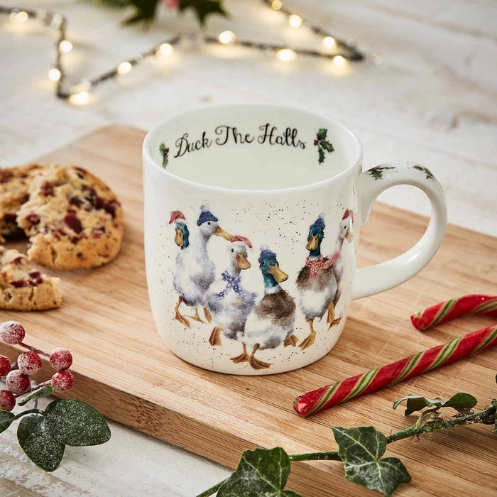 Wrendale Designs Duck The Halls Mug on holiday table with cookies and decorations.