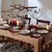 Festive holiday dining table setting featuring Wrendale Designs dinnerware and Rockin’ Robins mug.