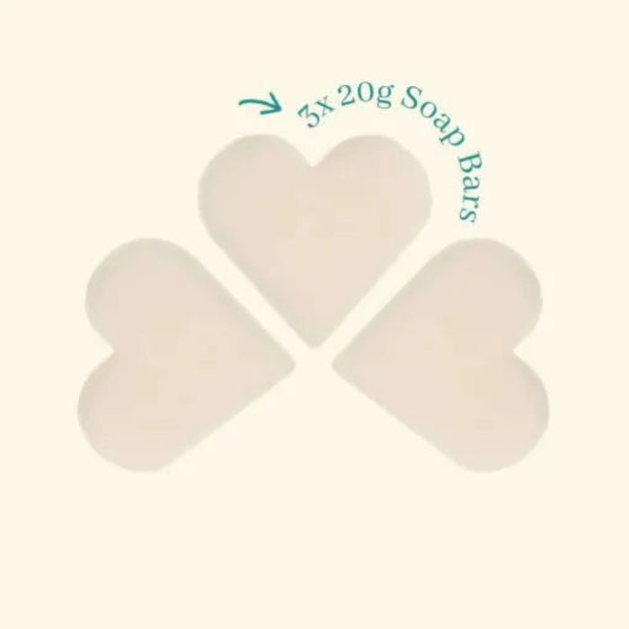 Three heart-shaped soap bars with text indicating '3x 20g Soap Bars' on a beige background.