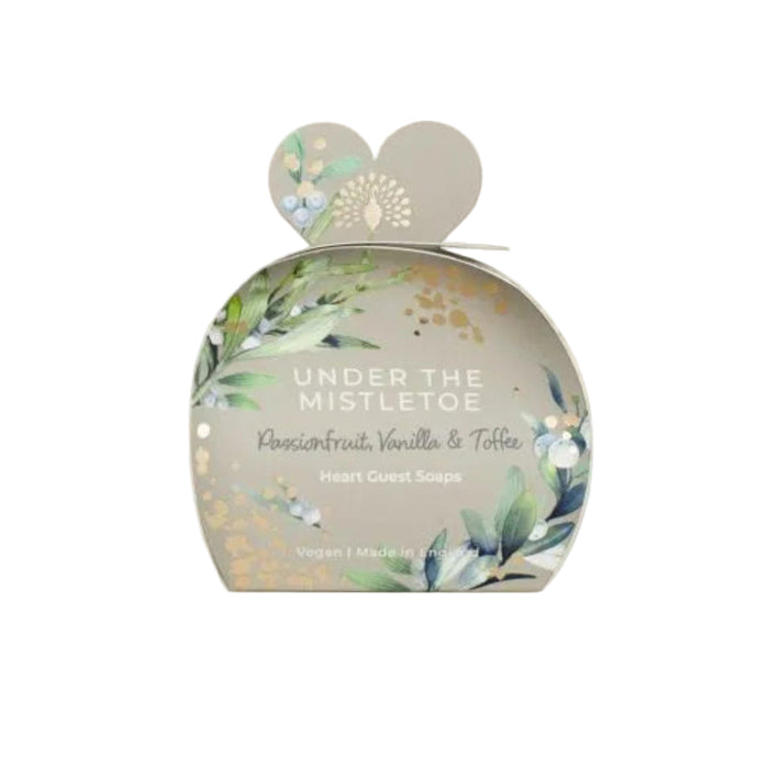 Packaged soap with 'Under the Mistletoe' design on a white background