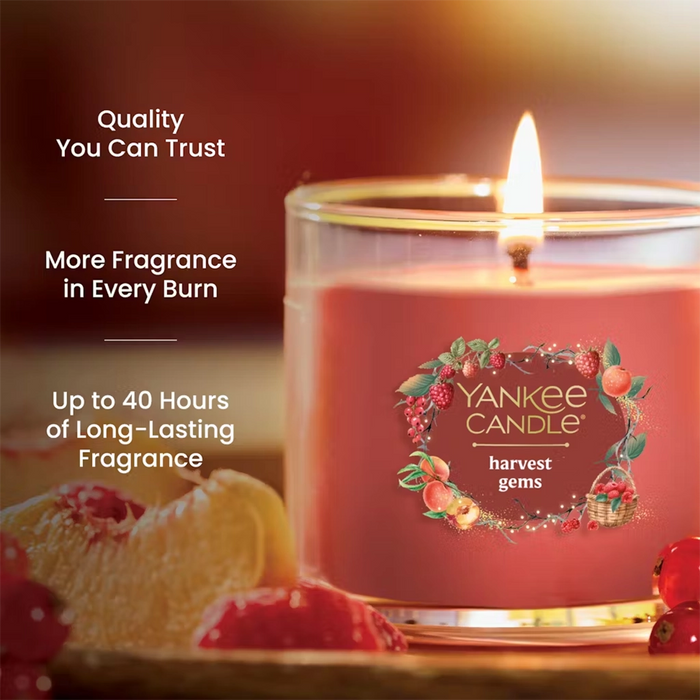 Yankee Candle harvest gems candle with decorative elements on a wooden surface