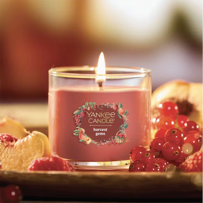 Yankee Candle harvest gems candle with fruits and berries on a blurred background