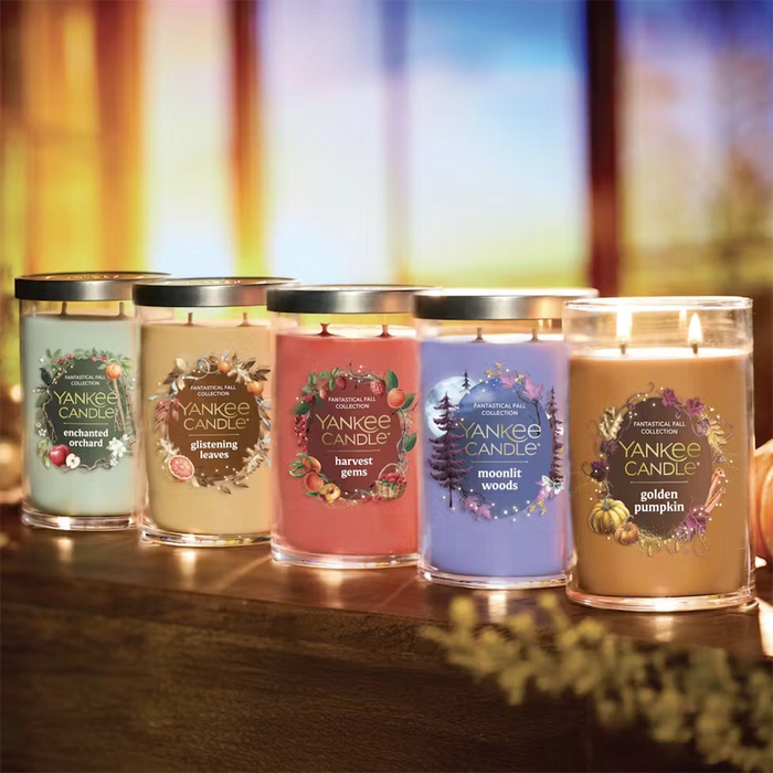 Yankee Candle fall collection candles with labels on a wooden surface