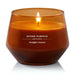 Yankee Candle Spiced Pumpkin lit in amber glass jar – cozy fall home décor.
