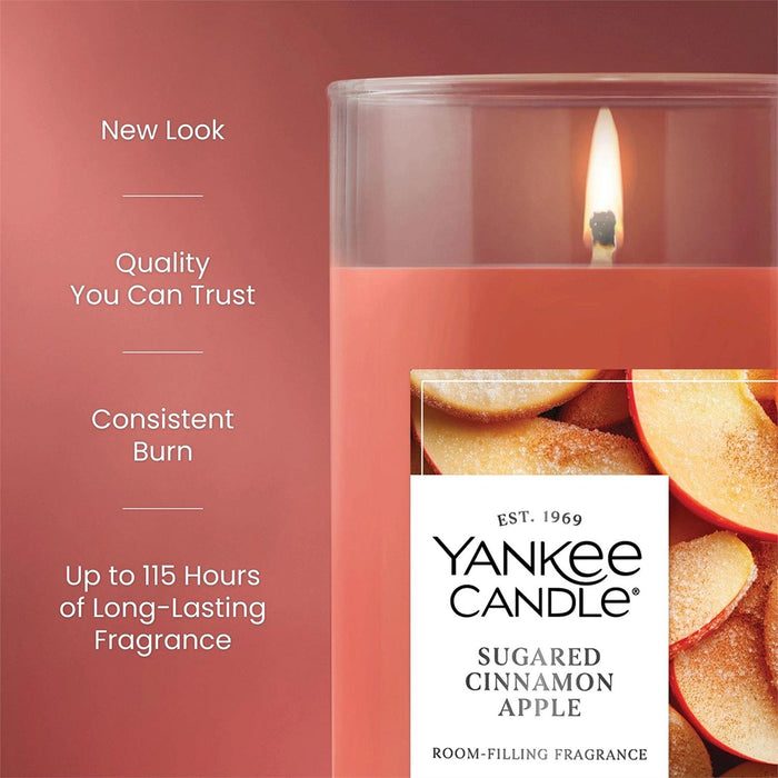 Yankee Candle Sugared Cinnamon Apple candle with text highlighting features on a red background