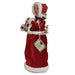 Left profile of Mrs. Claus figurine showing red stocking and festive detailing on velvet gown.