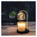 Elegant gold mercury glass candle warmer shaped like a small lamp, used to melt jar candles without a flame.
