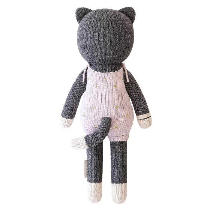 Back view of Nova the Kitten by Cuddle + Kind, showing pink starry overalls with bow detail and gray striped tail.