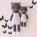 Cuddle + Kind Nova the Kitten dolls in regular 20 inch and little 13 inch sizes, handmade gray kitten with pink overalls.