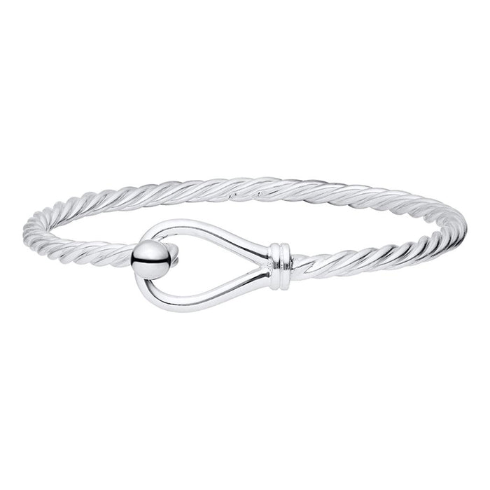 Silver bracelet with a heart-shaped clasp on a white background
